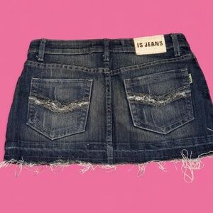 Mini dark wash denim skirt with distressed details